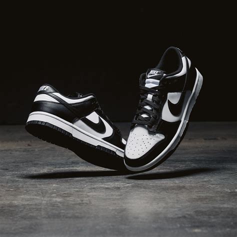 nike black and white sneakers women's|black and white nike lows.